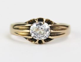 An Antique 9ct Gold and White Topaz? Solitaire Ring, the c. 6.3x5.9x4.3mm old cushion cut stone in a