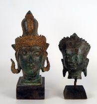 A Thai bronze bust of Buddha, mounted on a square wood base, overall height 15cm high, together with