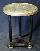 A Chinese brass topped occasional table, the circular top raised on three turned ebonised legs, 50cm