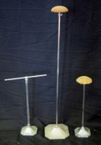 Two vintage adjustable hat stands, together with an adjustable scarf stand. (3)