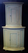 A 19th century Swedish corner cupboard, the upper part with moulded cornice and single panelled