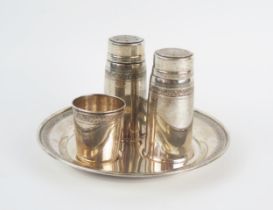 A continental four piece condiment set with glass liners includes salt, pepper, mustard and matching