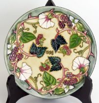 A Moorcroft pottery year plate '1998', designed by Rachel Bishop, No 249/750, 22cm diameter.