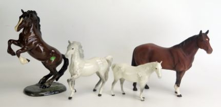 A Beswick model of 'Welsh Cob Rearing' Model No 1014, 26cm high, together with 'Quarter Horse', 25cm