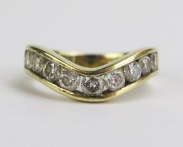 A 9ct Gold One Carat Diamond Half Hoop Ring channel set with nine brilliant round cuts ranging