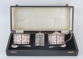 An Elizabeth II silver three-piece condiment set, maker Crisford & Norris Ltd, Birmingham, 1973/