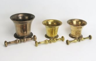 Three 18th century bronze and brass pestles and mortars, various sizes. (3).
