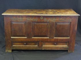 A late 18th century oak mule chest, of rectangular outline, with hinged lid, triple panelled front