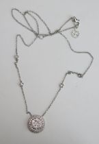 An 18ct White Gold and Diamond Pendant on an integral chain, stamped 750, 1.27ct, 13mm diam., 17.