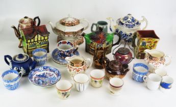 A collection of assorted ceramic tea wares including "Ye Olde Inne" teapot, biscuit jar, and milk