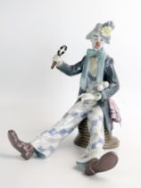 A Lladro figure, 5762, large clown with magnifying glass , 24cm