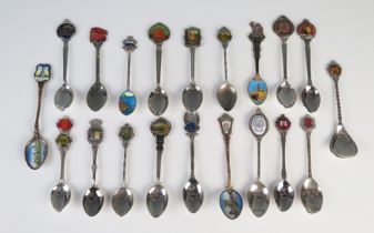 A collection of silver plated and enamel souvenir and other spoons.