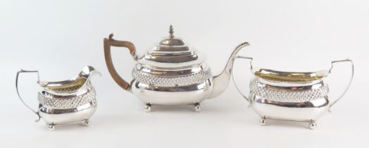 A matched George III silver three-piece tea service, makers marks worn, London, 1811 and later, of