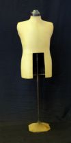 A Vintage anodised metal and linen covered shop mannequin, on an adjustable column and square base.