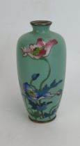 An Oriental cloisonné vase, of ovoid form with eggshell green ground and floral decoration, 13cm