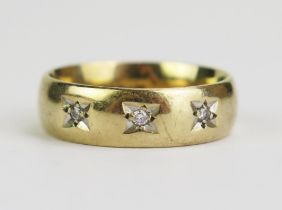 A Gent's 9ct Gold and Diamond Band, Birmingham marks, 7mm wide, c. 2mm stones, size T.75, 7.78g