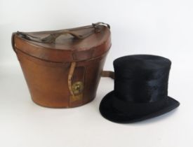 A Gents top hat Christy's, London, contained in a stitched leather hat box.