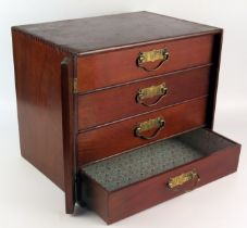 A stained beech collectors table top chest of four short drawers, with lockable stile, 37.5cm wide.