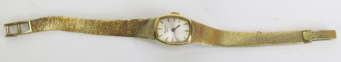 A DELVINA 9ct Gold Ladies Wristwatch on a damaged 9ct gold bracelet, 17.6g without movement but with