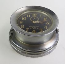 A Seth- Thomas WW2 AMERICAN U.S. NAVY DECK CLOCK NO. 1 the steel drum-shaped case with screw off