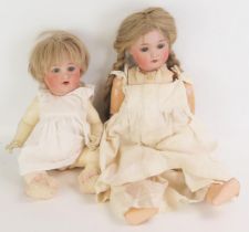 A W & Co bisque head doll, impressed W & Co, Thuringia, with fair plaited wig, weighted