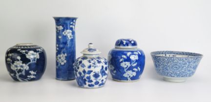 Two Chinese blue and white ginger jars with prunus decoration, a sleeve vase , bowl and jar and