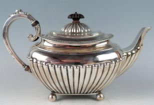 A late Victorian silver teapot, maker James Dixon & Sons, Sheffield, 1894, of barge-shaped outline