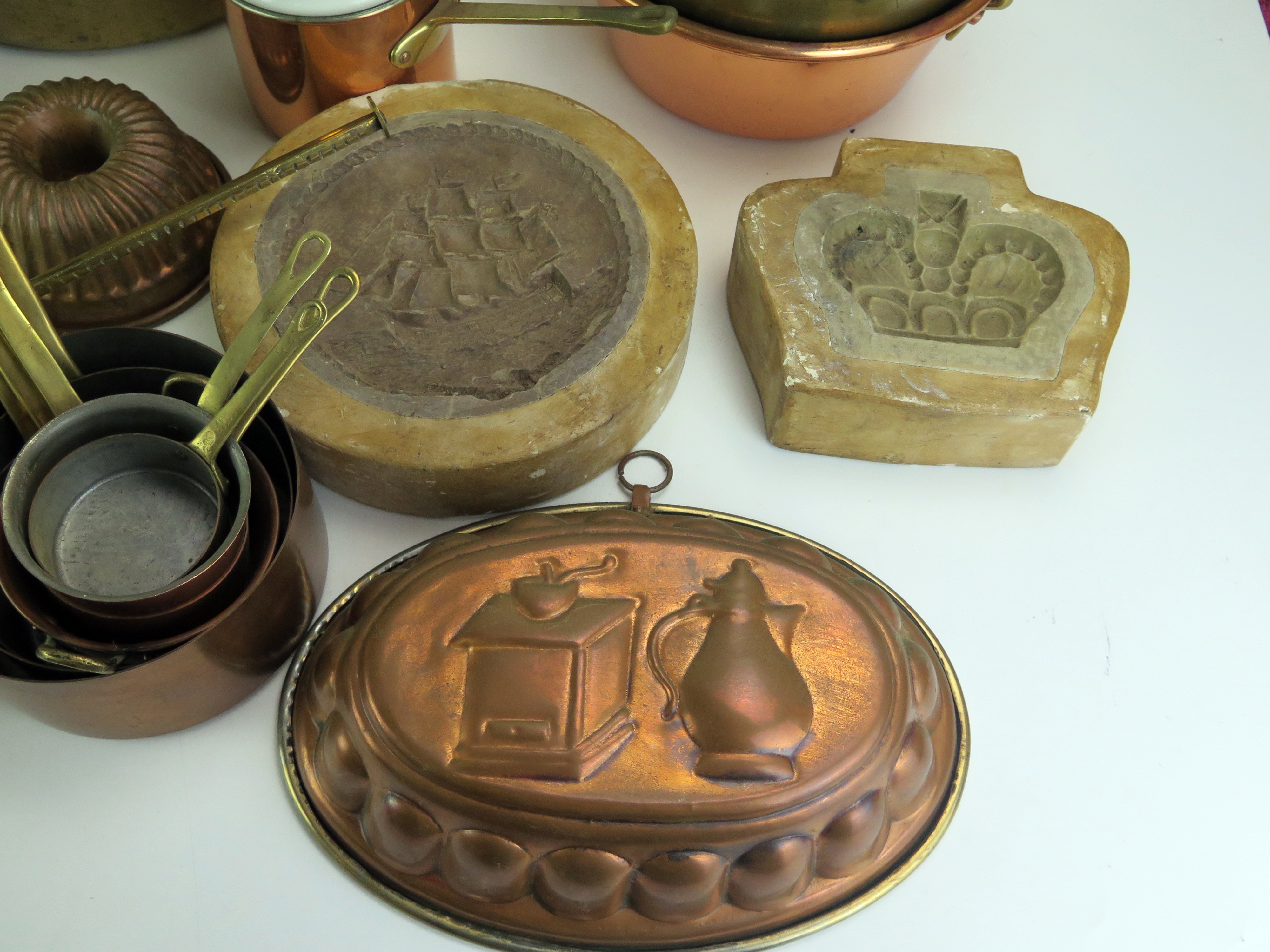 A collection of assorted kitchenalia, includes graduated saucepans, preserve pans, moulds, brass - Image 2 of 5