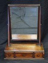 A late Georgian mahogany toilet mirror, with rectangular bevelled mirror plate, on a box base with