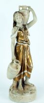 A Royal Dux porcelain figure of a female water carrier, impressed 2296 to the base, 30cm high.