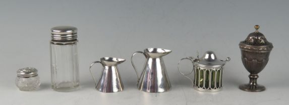 Two white metal miniature cream jugs, two clear glass and silver mounted jars, a silver mustard