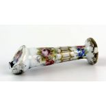 A Meissen porcelain whistle with floral decoration heightened in gilt, bears underglaze blue crossed