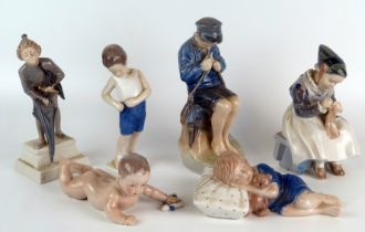 A collection of five assorted Royal Copenhagen porcelain figures of young children together with one