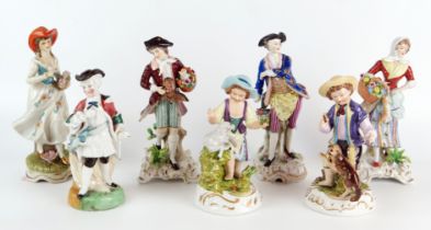 A group of seven mostly German porcelain figurines of gallants and ladies, various sizes. (7).