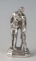A silver model statue of the Farnese Hercules, indistinct stamped marks, on a plinth base, 6cm high,