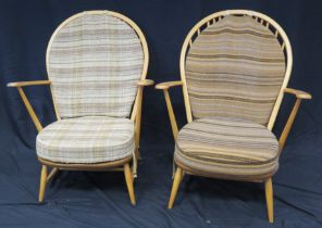 A pair of Ercol elbow chairs, with loose cushion padded back and cushion seat, raised on turned