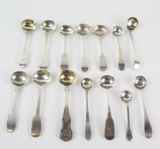 A mixed collection of condiment spoons, various makers and dates, includes mustard and salt