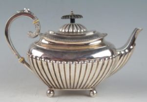 A Victorian silver barge-shaped teapot, maker James Dixon & Sons Ltd, with gadrooned border, and