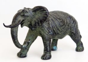 A 20th century bronze study of an elephant, unsigned, 28cm long.