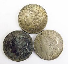 An USA 1897 Morgan Silver Dollar and two 1921 Morgan Silver Dollars