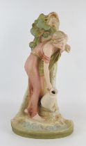 A Royal Dux figure of a young maiden gathering water from a spring, impressed 1431 to the base,