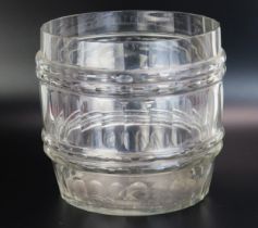 A clear glass ice bucket of barrel form with banded facetted decoration, 24cm diameter.