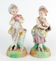 A pair of late 19th century German bisque porcelain figural spill vases with young boy and girl each
