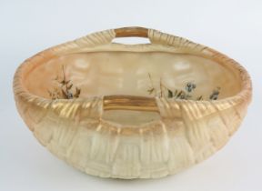 A Royal Worcester blush ivory basket weave fruit bowl, the interior decorated with floral sprays,