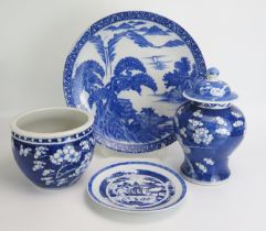 A large Chinese blue and white charger with landscape decoration, 37cm diameter, a small blue and