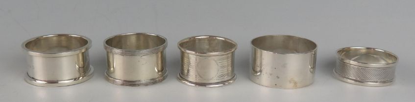 Five assorted silver napkin rings, various makers and dates, total weight of silver 94gms, 3.05ozs