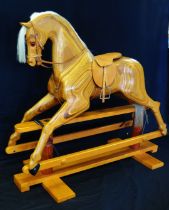 Relko, Devon, a late 20th century polished wood rocking horse, with open mouth, flared nostrils,