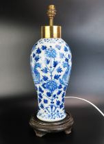 An antique Chinese blue and white vase of 40cm. ovoid form decorated with Fenghuang among