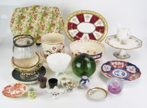 A mixed collection of glass and ceramic wares including Imari porcelain plate, glass float and