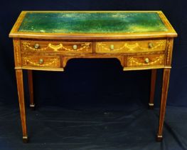 An Edwardian mahogany and inlaid writing table, of bow fronted outline, with tooled leather top,